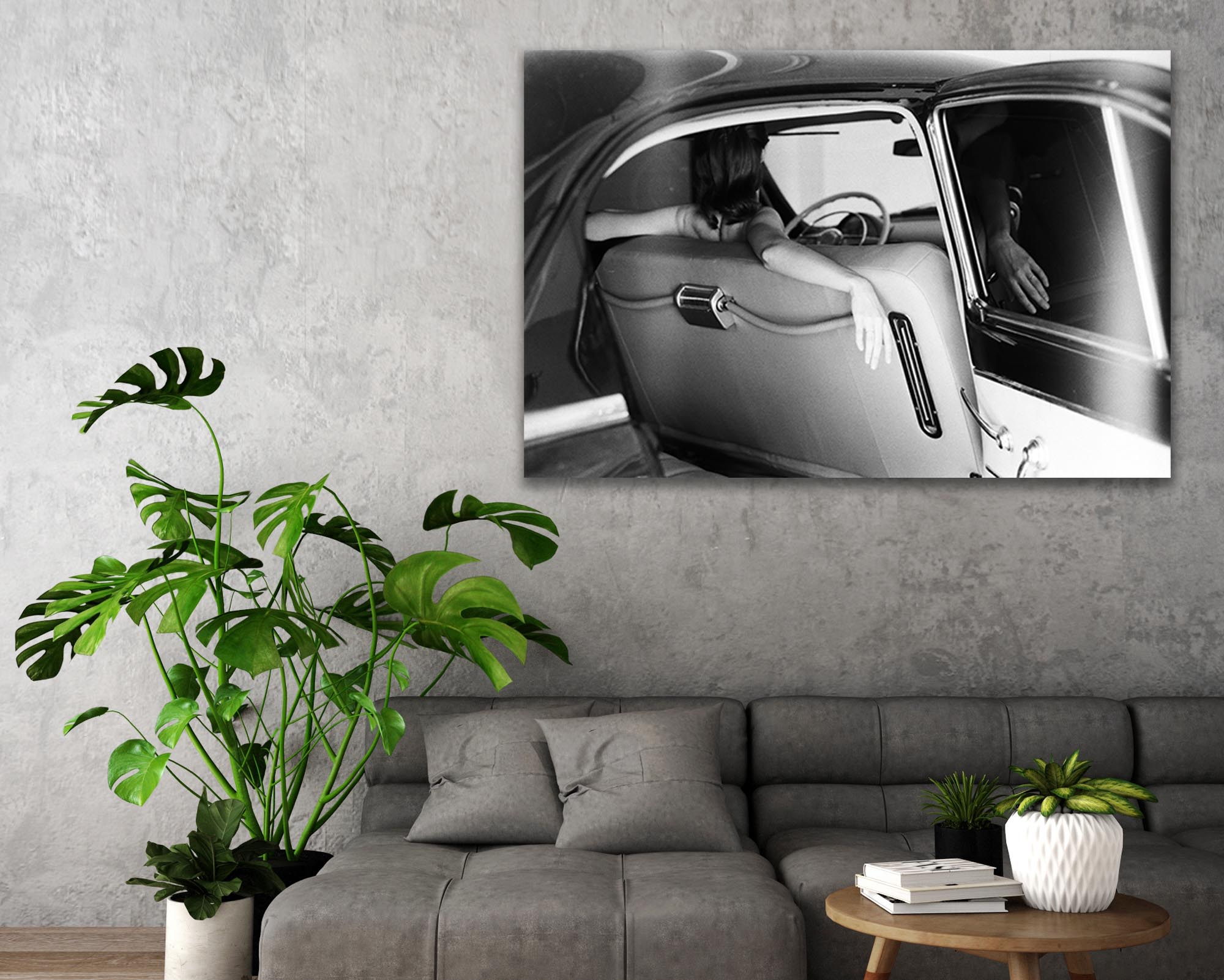 black and white acrylic face mount photo over grey couch