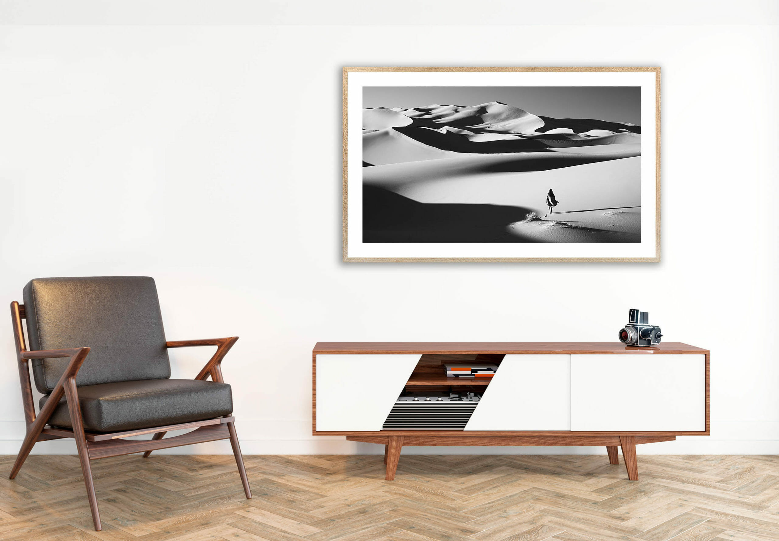 black and white image of desert lady above tv console