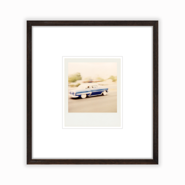 framed photo of an old car