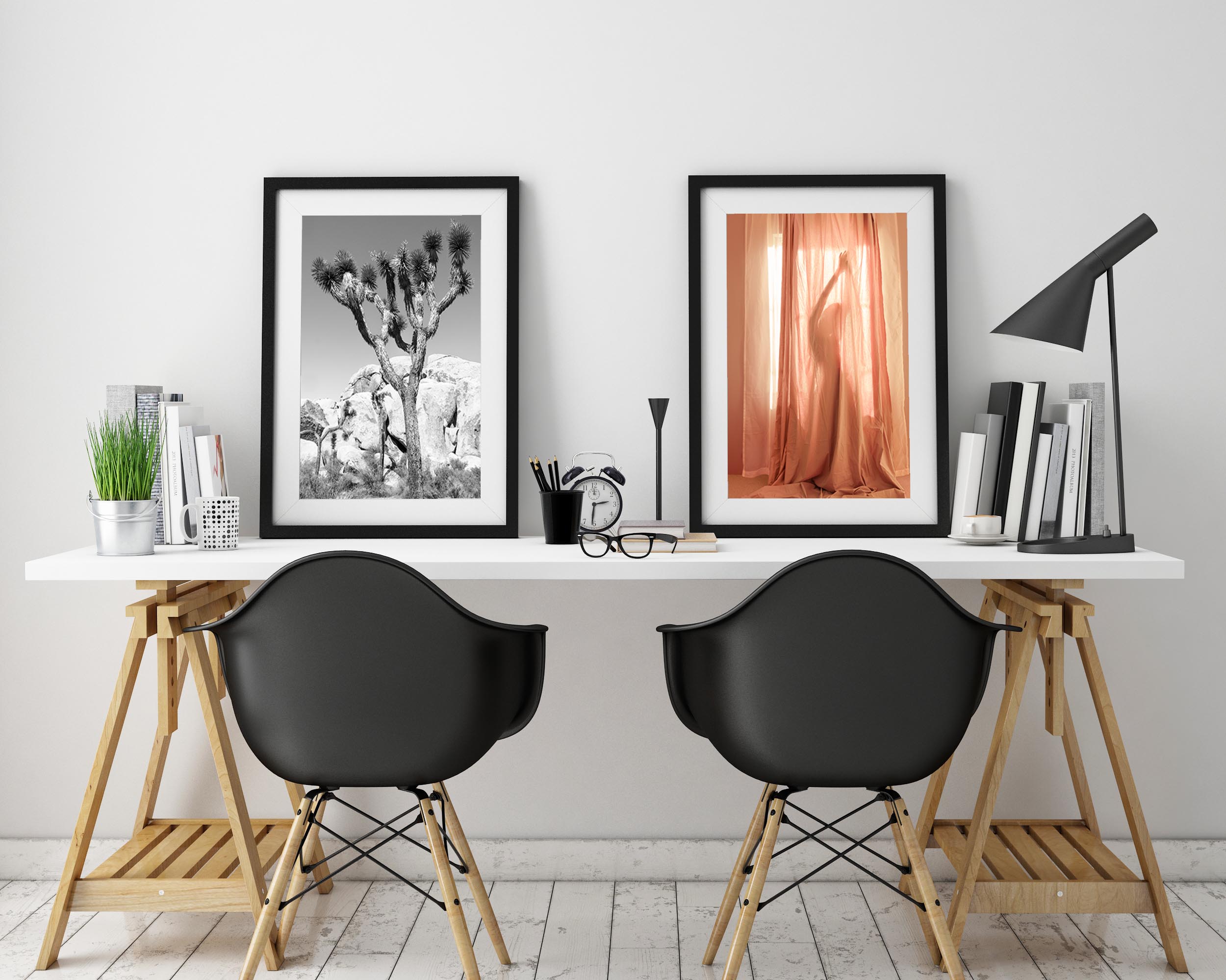 modern desk set up with two fine art photos