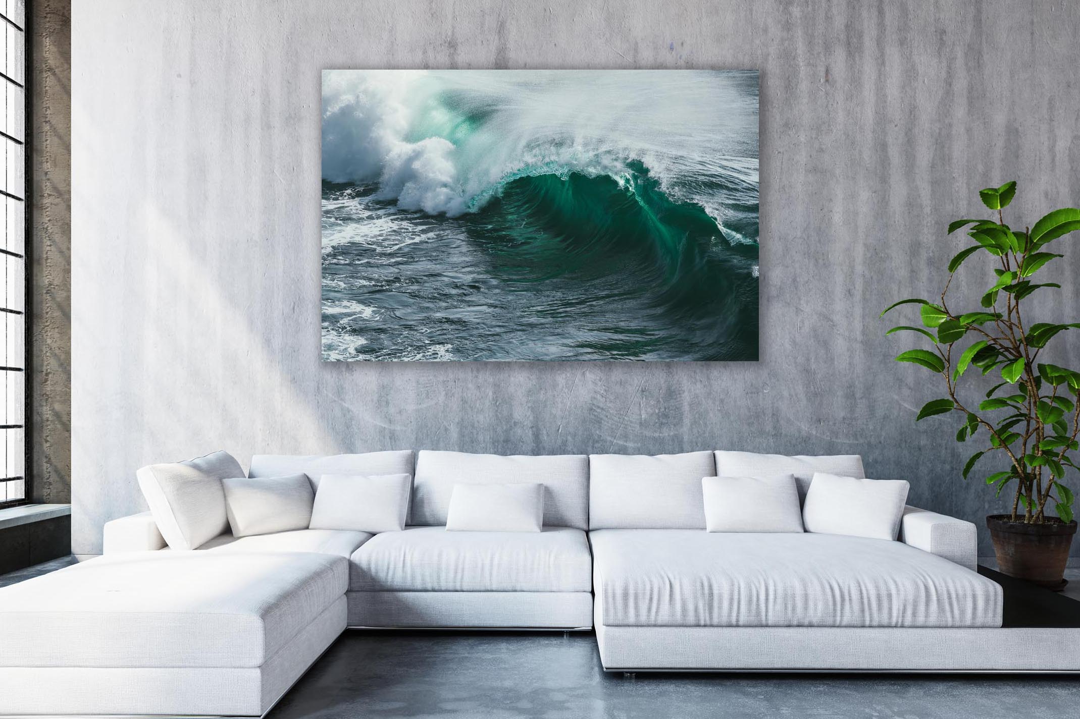large white couch with image of huge wave